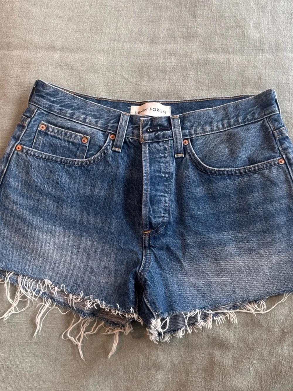 Denim Forum the yoko short.  Distressed Blue High-Rise Frayed Hem Denim Shorts